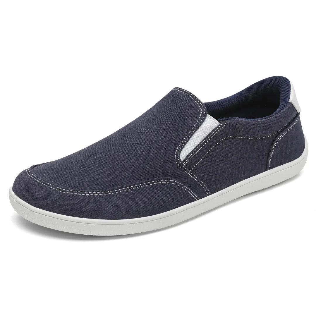 Zapatilla casual sin cordones azul marino, tejido canvas resistente.