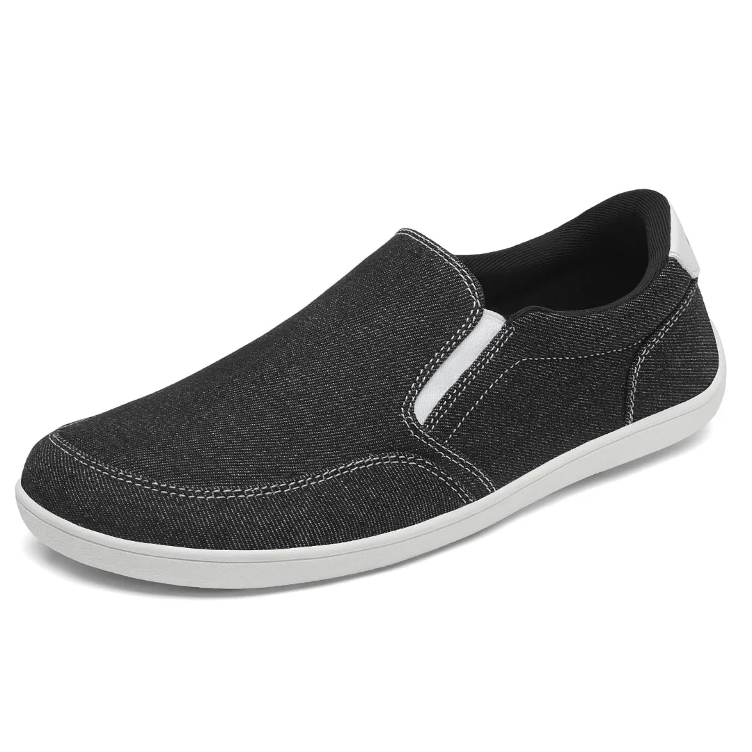 Zapatilla casual sin cordones negra, estilo alpargata minimalista.